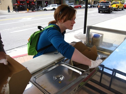 Indian food cart with a tandoor oven. Kim runs it, Dustin does the business from Iraq.