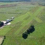Grass airfield in central Scotland run by a not-for-profit company. Home to Microlight & Sportflight Scotland flying schools. Site of a Grand Designs house.