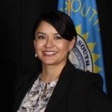 South Dakota State Senator, Dist. 27 from the Pine Ridge Indian Reservation. Oglála Lakhóta born for Kinyaa'áanii/Diné (Navajo), indigenizing state politics.