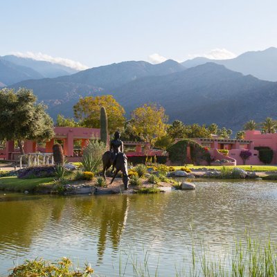 An iconic 12-acre Palm Springs estate with breathtaking 360-degree mountain views and a beautiful pond