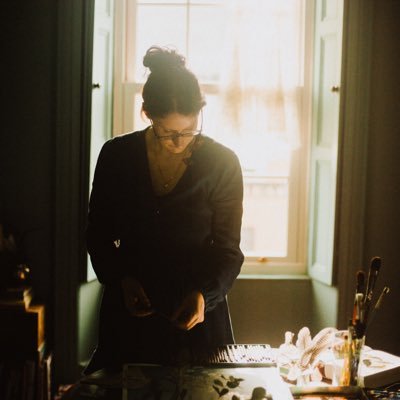 Artist - making portraits of women in a secret language.