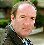 A parody account of a fictional character off Brookside.  Not that a fictional character can even be real, like?  http://t.co/q7xAchs2Td