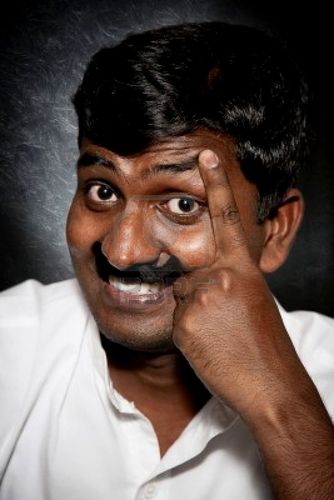 9265240-handsome-indian-man-with-moustache-and-raise-eyebrow-smiling-and-looking-at-camera-close-up.jpg