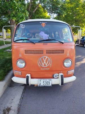 I'm a 1969 VW Woodstock bus owned by Queenfoofigher. I haul the music, the merch and the people. You can rent me for events, and sometimes I'm a pop up shop.