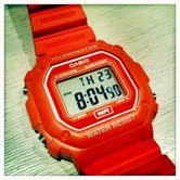 i'm a watch. not a gold watch. i dont have a leather strap. compass is not included. just a strap to your wrist, wear to the state fair, red watch. by Casio.