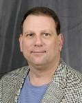 I'm a technology businessman, and also I work very hard at helping any charity raise money. I have coached high level hockey for 25 years.