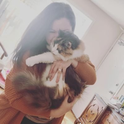 masters student, cat mom, setting unrealistic reading goals, probably drinking coffee