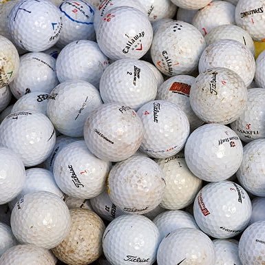 Some college kids trying to make some money by selling affordable used golf balls.