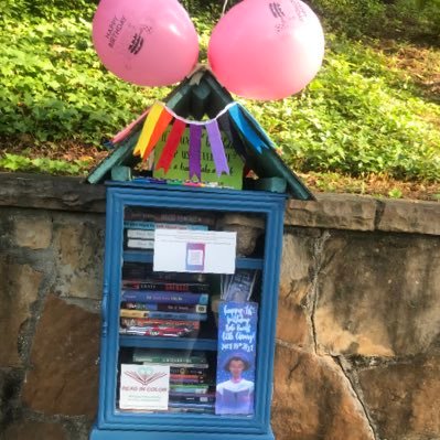 A little free library for books with central characters of color and that promote racial equality located in Homewood, Alabama