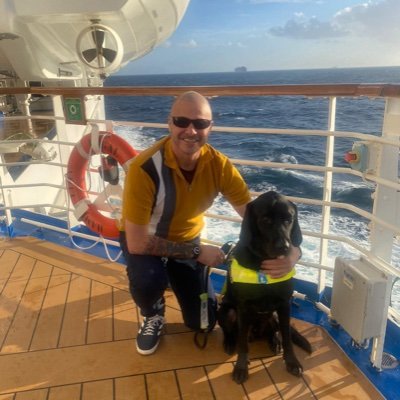 Blind Hiy, living his best life with Guide Dog Spencer by his side