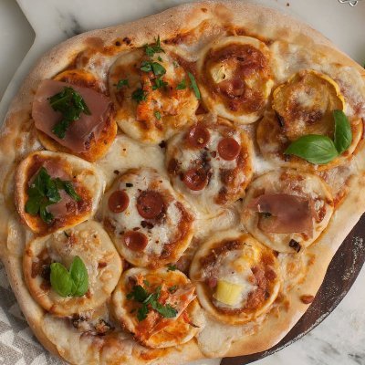 Pizza with little pizzas as toppings