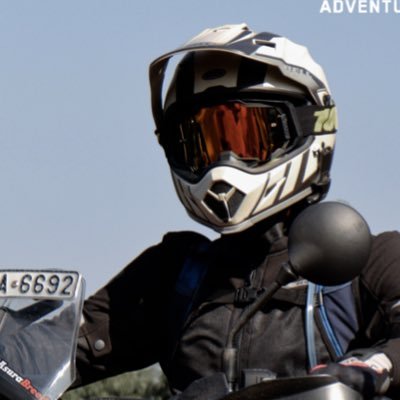 An adventure motorcycle traveler looking for all the back roads leading to rural India