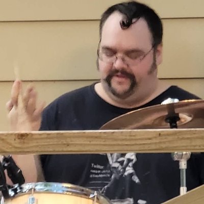 Person who makes music of dubious quality, mainly on drums sometimes mandolin or accordion. Devout Memphian.