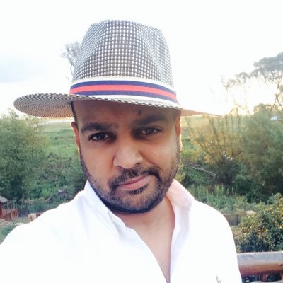 Taz Khan M.B.E Profile