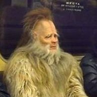 Just a guy in a weird suit on a train