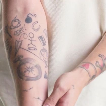 daily pics of louis tomlinson tattoos