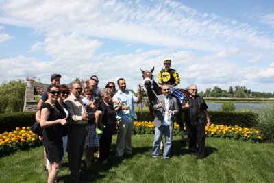 A Canadian based thoroughbred racing operation. Thumbs up in the winner’s circle!