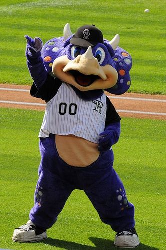 I am a purple dinosaur. I like walking around, spinning my head, launching t-shirts, and distracting pitchers in the 9th inning. I am not actually Dinger.