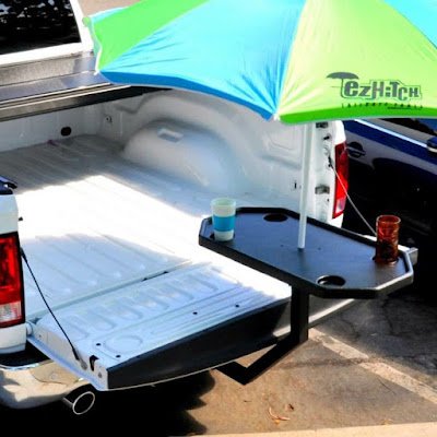 EZ Hitch Tailgate Table it a portable table that goes on your vehicles trailer hitch. Great for tailgating, roadtrips, job sites, camping and MORE!