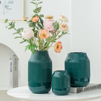 we are porcelain flower vase
and candle holder manufacturer from china, some of flower vase is made in stock, hope we can have good coperation.