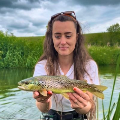 Woman Fly Fishing A Small Stream by Stocksy Contributor Aimee