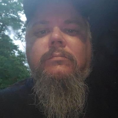 GreaseM55368733's profile picture. Bearded man with dad body