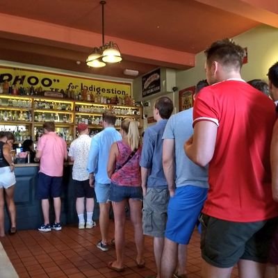 A campaign to end the recent phenomenon of queuing single file in pubs. We queue for the bus, or for the checkout not at bars.

Message in your photos