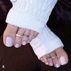 Adoring pretty toenails
