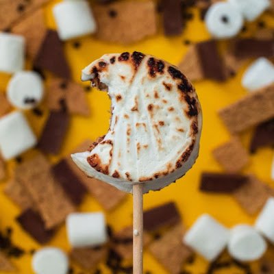 Roastable, Inside-Out S’mores each containing a crunchy handmade graham cracker, covered in decadent chocolate, all inside a fluffy marshmallow on a stick!