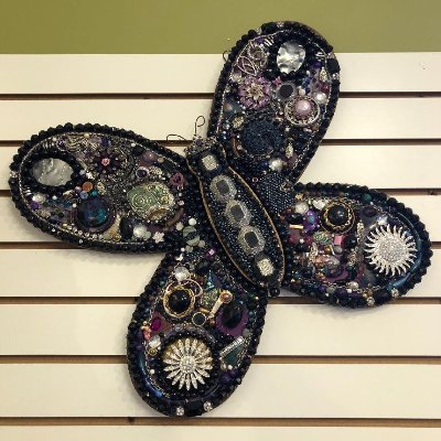 Mosaic artist using vintage jewelry, former boutique owner in St. Charles. Founder of 