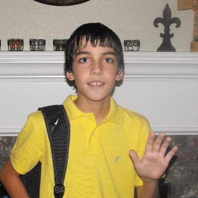 a boy leaving a croc-shaped footprint on the world