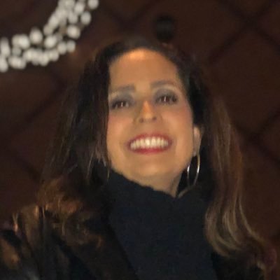 KCKPS High School Educational Coordinator. Latinas sitting at sports table. Go KCKPS