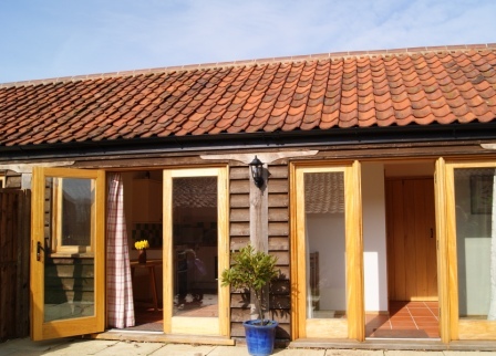 Two lovely, eco-friendly barn conversions and a Shepherd's hut on a picturesque farm near Aylsham.