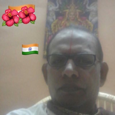 By desireless action; by renouncing the fruits of action; by dedicating all activities to God, i.e. by surrendering oneself to Him body and soul.