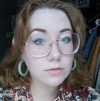 condensedmik's profile picture. 29. rust belt socialist, union gal, nerd about cryptids, eclectic collector of things. cat mom who puts the rad in radical librarian 📚🚩☭ she/they/yinz