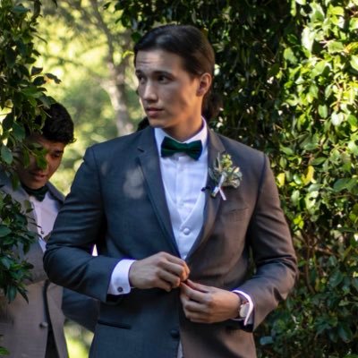 my profile picture is me trying to look like a spy on my wedding day. former blue check