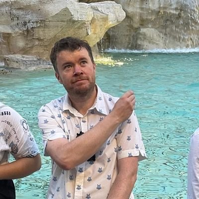 Architect, Father, Poodle Owner. Welsh Ambassador to Yugoslavia. Director of Hughes Architects. Director of Newtown AFC.