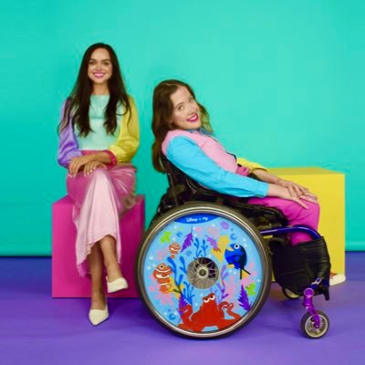 If you can't stand up, stand out! 🌈 • Designer wheel covers for wheelchairs • Created by sisters Izzy & Ailbhe • Forbes Under 30 ✨