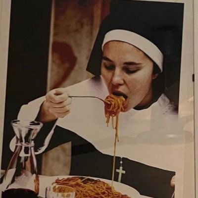 nun eating spaghetti