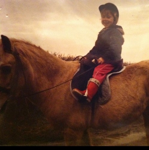 A small person who rides horses.