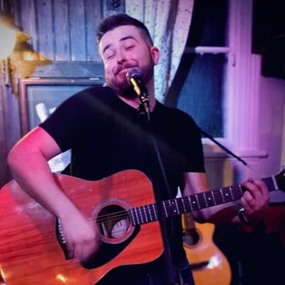 Singer playing Guitar and Piano living the best and happiest i can