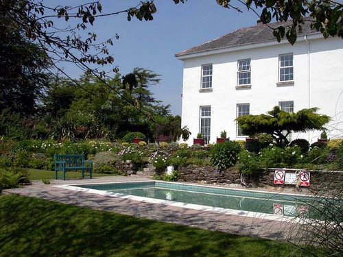 Relaxing in the sun by the pool in a peaceful garden with a good book. Outside a gorgeous old house a mere 10 minute drive from the sea. Perfect? 01503220247