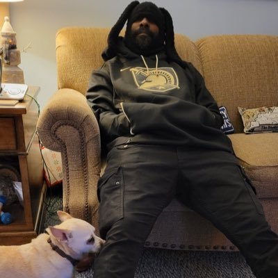 therealaus's profile picture. Army Veteran wearing God's letterman. ♠🏁