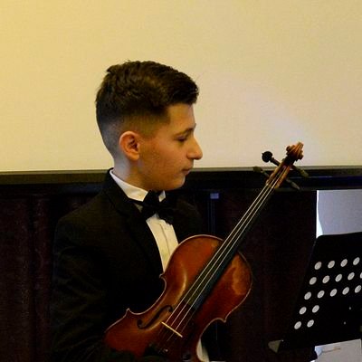 This is official acount of violin soloist Alexandru Zamira, a little genius* according to the newspaper article.