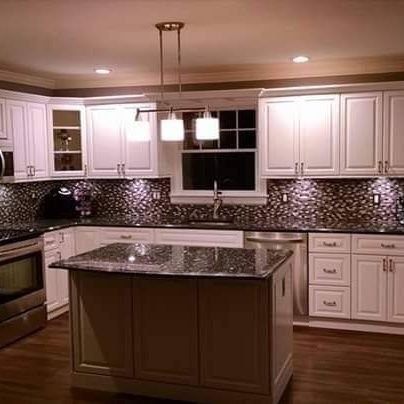 Professional kitchen cabinet refinishing and refacing.
 From strip and stain to Factory sprayed painted. We provide many kitchen cabinet updating options.