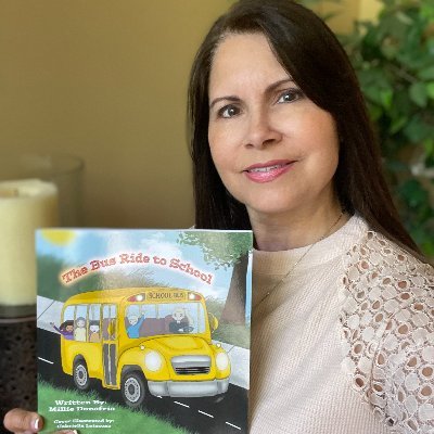 Millie Donofrio, author of The Bus Ride to School, and Mason, The Blue Boy Puppy.