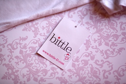 A women's fitted T-shirt line made with 100% organic cotton & rhinestone embellishments. Sold at www.bittle-D.com. Founded by 2 sisters. Fashion+Philanthropy.