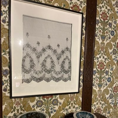 British artist who creates detailed ink drawings of lace and lace garments from museum collections in the Uk and France