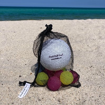 Beach Ball Toss!  Similar to bocce ball but for the beach and much more fun!  Visit our website for more info!