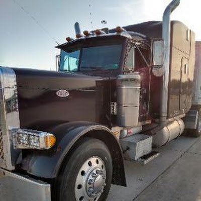 ANTI-COMMUNIST....... An American Diesel driving grain hauler and DAMN PROUD OF IT!!! If it wasn't for us, nobody would eat, PERIOD END OF STORY!! TRUCKIN USA!